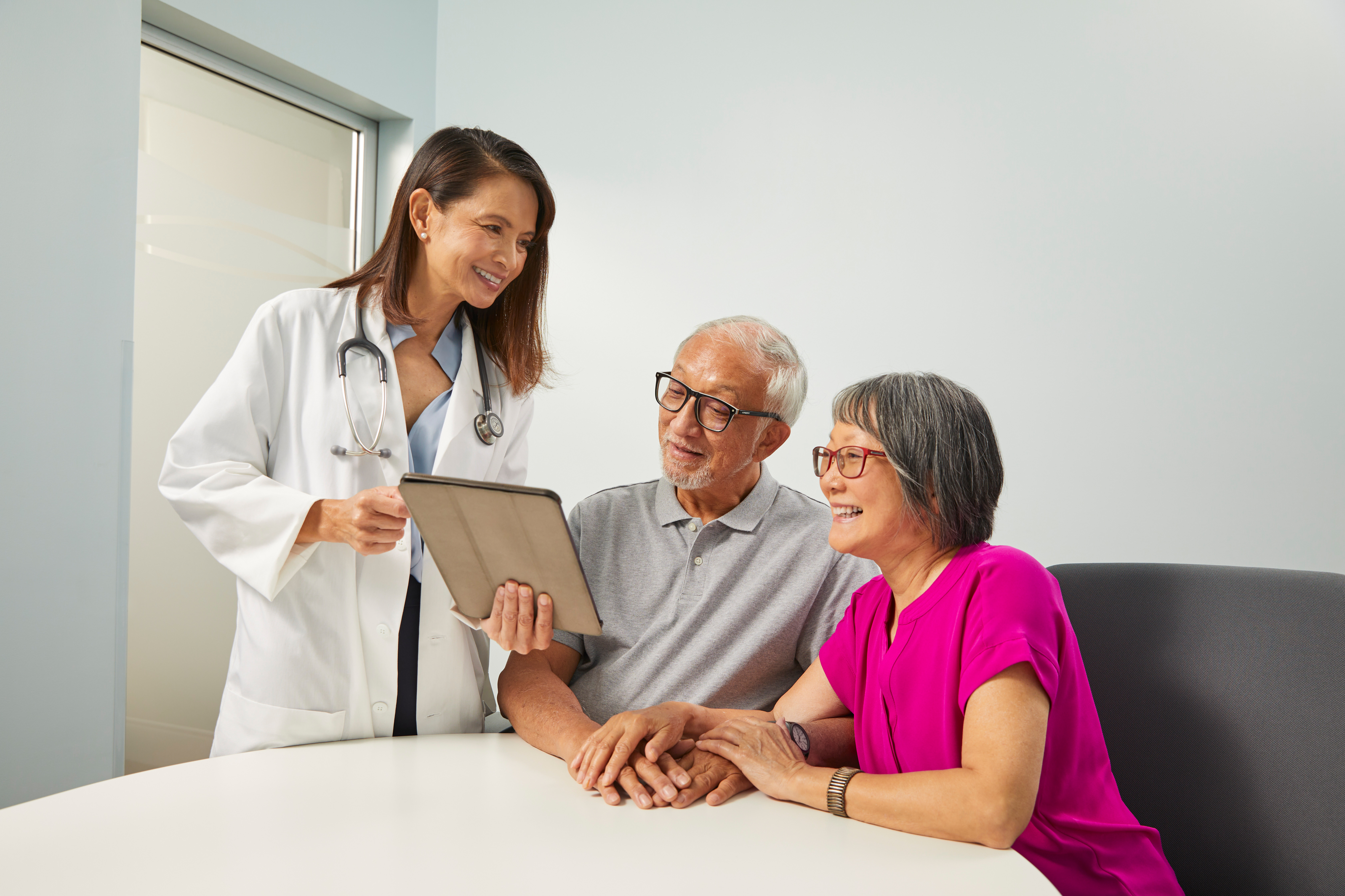 Provider consulting with senior couple